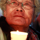 An elderly woman holds a candle during a rally against South Korean president Park Geun-Hye in Seoul in November 2016.